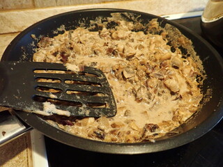 mushroom sauce on a frying pan in kitchen