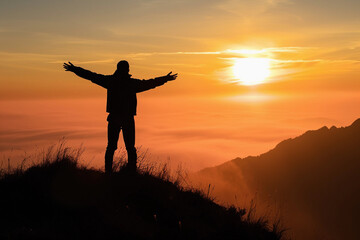 silhouette of a person standing at the top of a mountain, arms spread wide, facing a rising sun, conveying a sense of achievement and empowerment