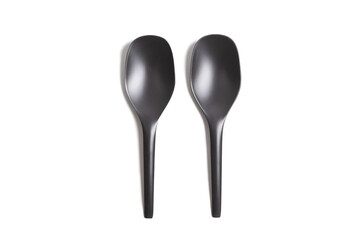 two black plastic spoons isolated on white