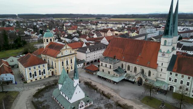 Left rotating flight at Kapellplatz showing Gnadenkapelle St Magdalena and Stiftskirche in Altoetting