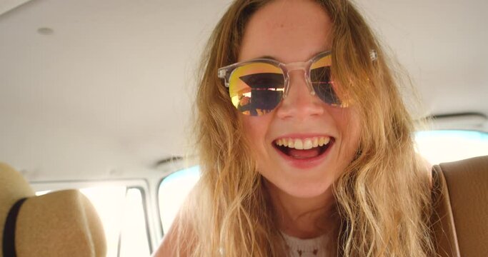 Woman, road trip and happy with camera in van for vacation, memory and photoshoot on drive. Gen z person, girl and photographer in car, transportation and smile for journey on holiday in Spain