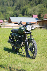 Naklejka premium Classic motorcycle in the village