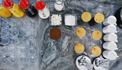 Countesses with various juices, teapots, and cups on the buffet table at the hotel for breakfast....