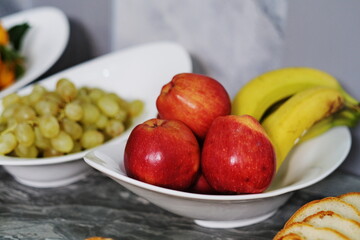 Red apples on a plate.