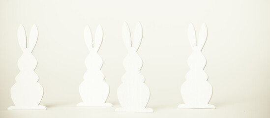 Easter Holiday minimal concept. Row of decorative multicolored easter bunnies isolated. Creative...