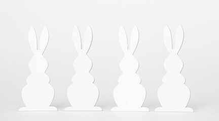 Easter Holiday minimal concept. Row of decorative multicolored easter bunnies isolated. Creative flat lay. For design cards or web banners. Copy space