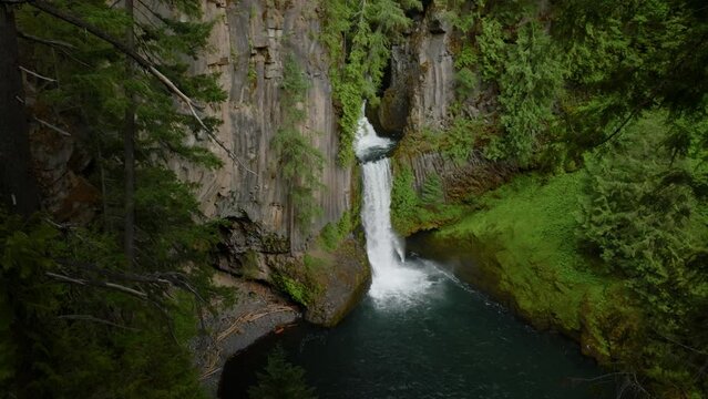 Huge waterfall in lush forest, Oregon.