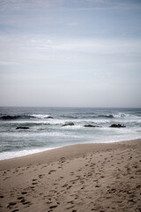 beach in the morning, strong waves on rocks