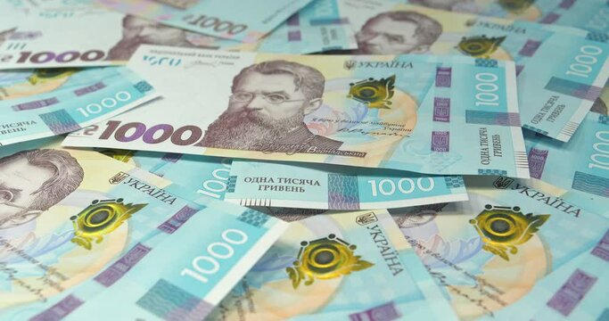 Ukrainian banknotes. Money of Ukraine. New banknotes 1000 Hryvnia in uncirculated condition, UNC. Real Ukrainian paper money of blue yellow color, UAH. Cinema 4K video
