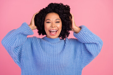 Photo portrait of attractive young woman touch head excited impressed wear trendy blue knitted clothes isolated on pink color background