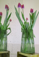 Reflection of tulips in vase in the mirror 