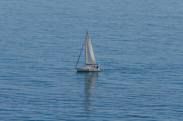 yacht sailing the sea, clear sky and blue water, recreational sport