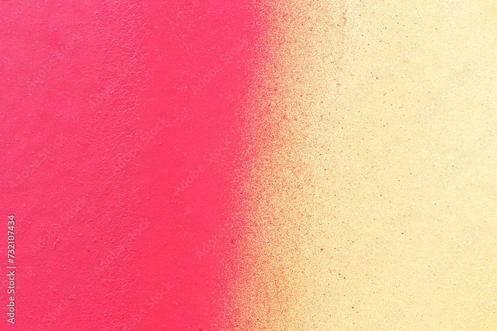 Poster macro close-up of a wall spray painted with pink and yellow. abstract full frame textured splattered