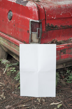 white blank poster for mockup on a damaged car in an abandoned forest, red background, potrait wallpaper 5