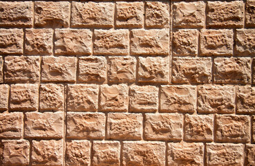 Empty Background of wide cream brick wall texture.