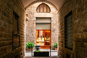 Fototapeta na wymiar No people graphic design resource of a traditional european street under arch corridor with old stone brick and wooden facade. Nobody, travel tourism. Photo editing frame