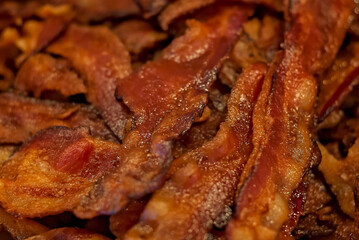 Fried bacon strips are pictured, July 9, 2011, in Columbus, Mississippi. Bacon is a type of salt-cured pork created from the meat of pigs. The most common form of bacon is side bacon, also known as
