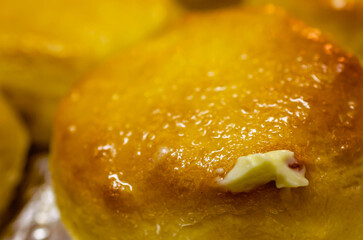 Southern-style biscuits topped with butter, Jan. 18, 2016, in Coden, Alabama. In the United States, biscuits are a type of soft bread frequently served at breakfast or as a side dish to meals. 