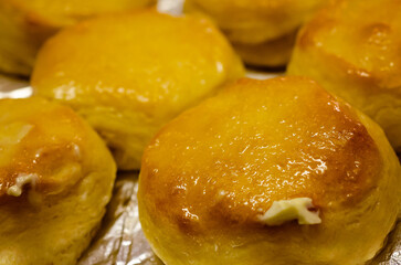 Southern-style biscuits topped with butter, Jan. 18, 2016, in Coden, Alabama. In the United States, biscuits are a type of soft bread frequently served at breakfast or as a side dish to meals. 