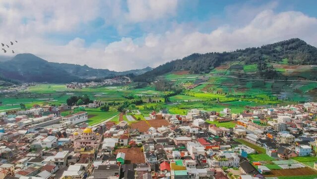 Landscapes beautiful village of Dieng wonosobo central java Indonesia. Seamless looping 4k video background with moving clouds. 