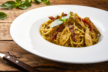 Creamy Chicken Pesto Spaghetti served in dish isolated on table top view of arabic tasty fasfood