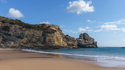 View st the beach of Praia do Barranco with clear turquoise water and a blue sky, Sagres, Algarve,...