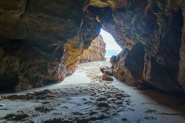 view out of the cave at the ocean