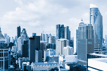 Closeup image of Bangkok cityscape. Modern skyscrapers with monochrome blue filter. Modern...
