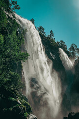Large Hesjedalsfossen waterfall next to the road in Hordaland, Norway. Long exposure of flowing...