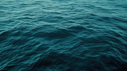 Obraz premium The deep blue waters of the ocean exhibit a dynamic texture, creating a sense of mystery and the vast, untamed nature of the sea