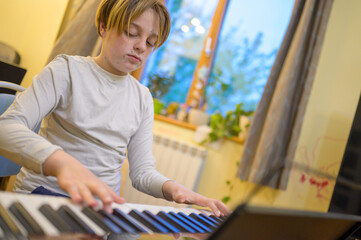 Boy with chickenpox playing piano