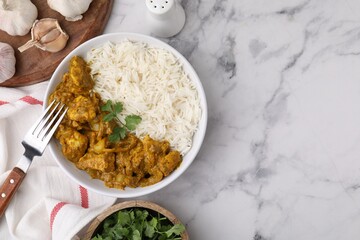 Delicious chicken curry with rice and ingredients on white marble table, flat lay. Space for text