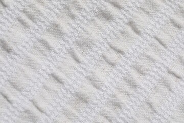 Texture of light fabric as background, top view