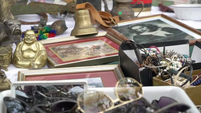 Flea market old vintage products with frames copper stuff bell and any other old but gold things