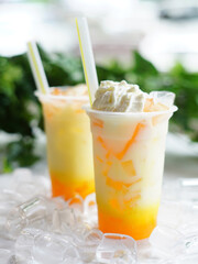 Delicious and refreshing milk based beverage, ice milkshake, cold drink, with different topping and...