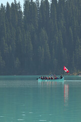 Canoe in the clear water mountain lake 
