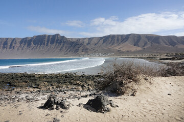 Landscape of the wild surf beach Famara in the north west of Lanzarote