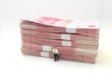 business man stand font of Stacks of Chinese Yuan Banknotes,