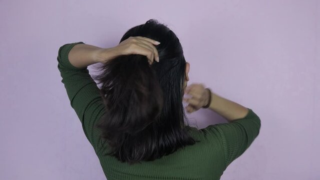 Young Asian Woman Doing Hair Style, Hairdo, Girl Making a Ponytail