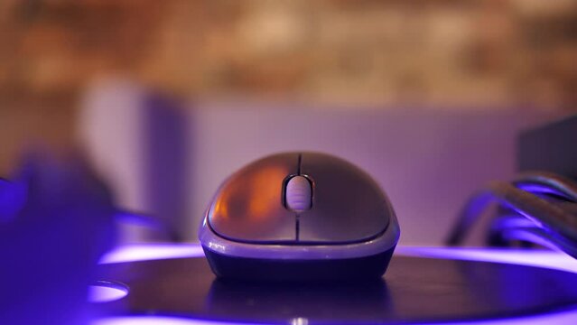 computer mouse on a flashing table. Workplace close-up