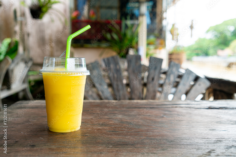 Poster mango smoothies in take away glass