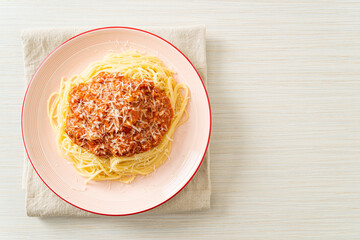 pork bolognese spaghetti with parmesan cheese