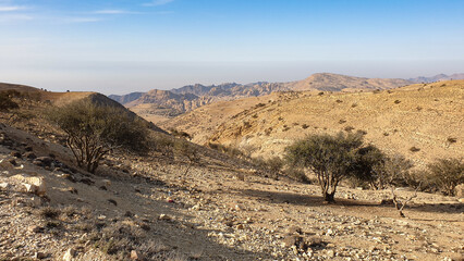 Scenic panoramic landscape view of dry, arid desert and mountainous terrain in Jordan, Middle East