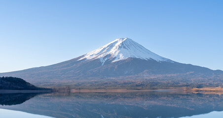 Fototapeta premium Aerial Panorama Landscape of Fuji Mountain. Iconic and Symbolic Mountain of Japan. Scenic Sunset Landscape of Fujisan at Evening Time, Kawaguchiko, Yamanashi, Japan.