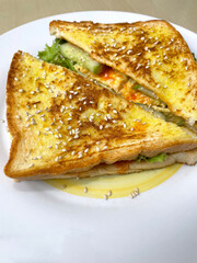 Toast with vegetable filling on white plate. flat lay, top view. Sandwich with vegetables