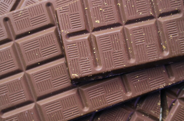 Top view of piled up dark chocolate bars