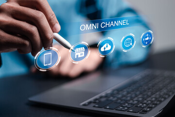Omni Channel concept. Person use laptop with virtual omni channel icons for business and social media marketing.
