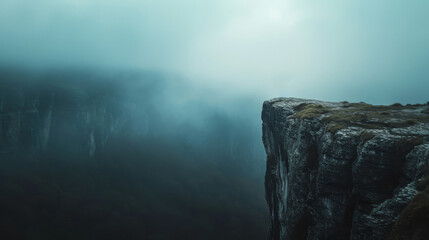 Rock cliff edge against a fog and clound dark sky with mountain - obrazy, fototapety, plakaty