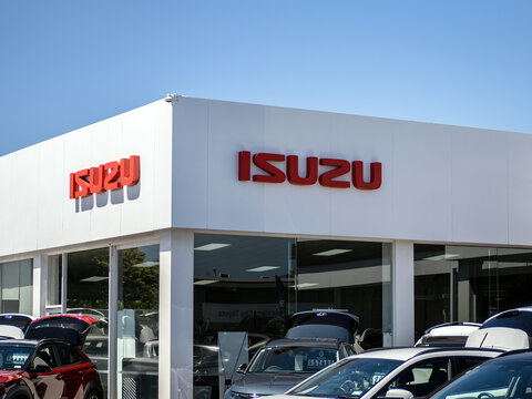 Isuzu car dealership yard signage. Auckland, New Zealand - February 8, 2024