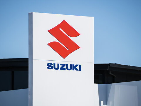 Suzuki car dealership yard signage. Auckland, New Zealand - February 8, 2024
